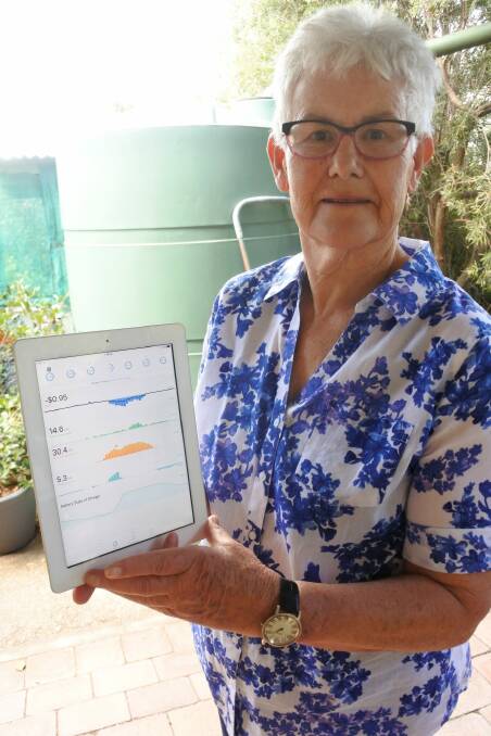 Lainie uses real time monitoring of the system to oversee energy use and creation.  Photo: Georgina Connery