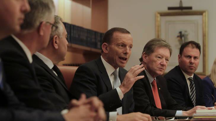 Prime Minister Tony Abbott and Treasurer Joe Hockey meeting with senior advisors, including Treasury secretary Martin Parkinson and Prime Minister and Cabinet secretary Ian Watt. Photo: Andrew Meares