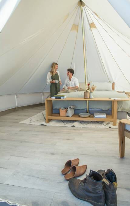 The tent has a full king-sized bed with luxury linen, and a custom-made table and armchair. Photo: Karleen Minney