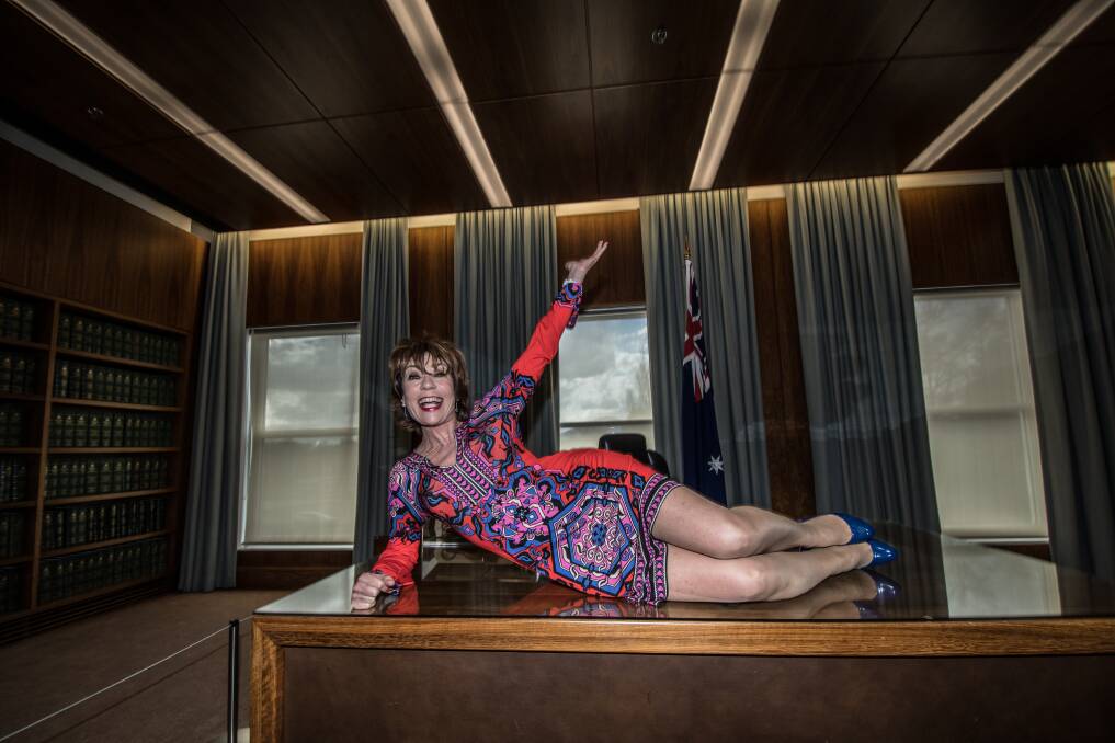 Author Kathy Lette in the prime minister's suit at Old Parliament House on Friday as they leadership ballot played out up on the hill. "I don't want to flash a fallopian tube.'' Photo: Karleen Minney