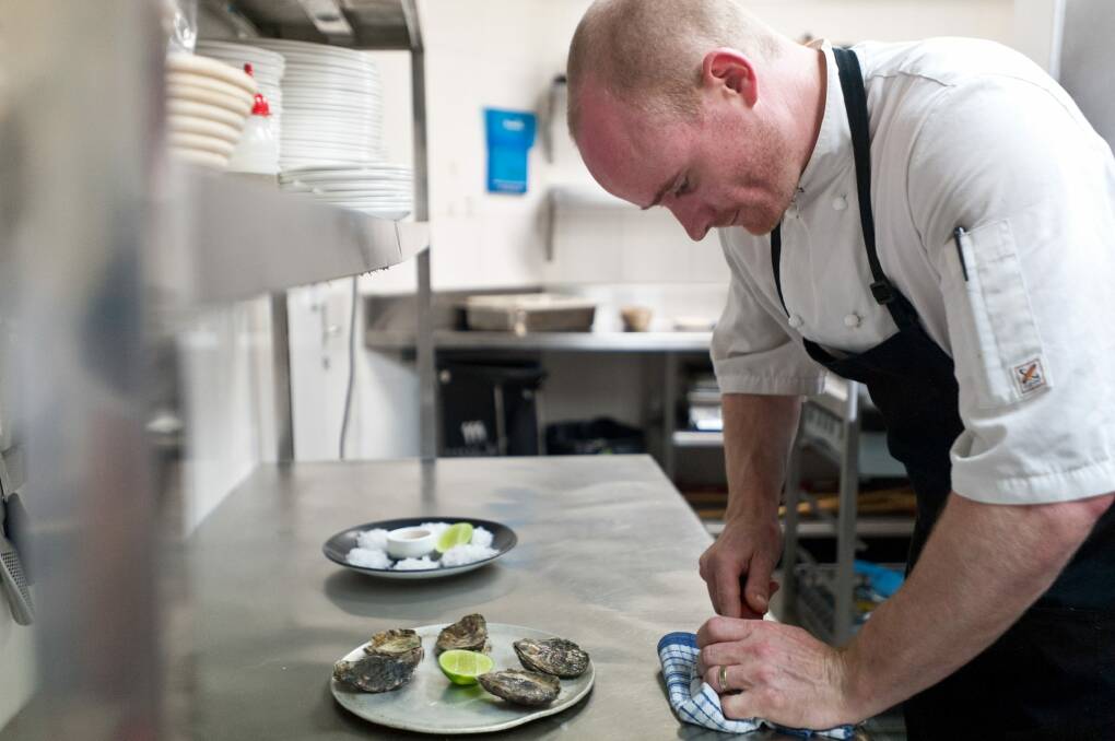 Awe shucks: Temporada chef Chris Darragh prepping the beautiful oysters. Photo: Daniel Spellman