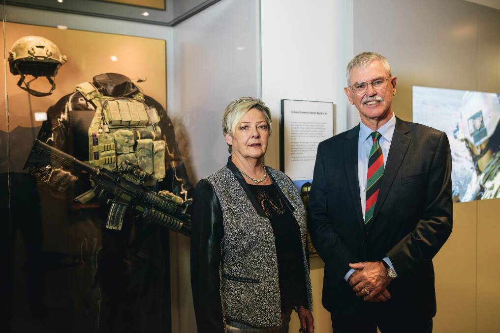 Equipment worn by Corporal Cameron Baird VC on display at the Australia War Memorial. Baird's parents, Doug and Kaye Baird with the equipment. Photo: Rohan Thomson
