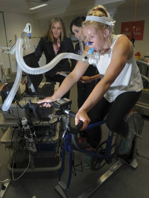 New level: Canberra Capitals coach Carrie Graf in the physiology lab with Phd student, Kristy Martin.  Photo: Graham Tidy