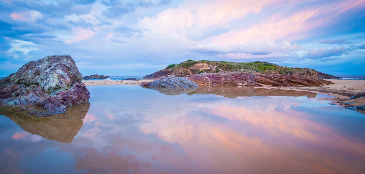 "Bournda Island on the Sapphire Coast is a magical place at dusk. The sands move and different rocks appear on the beach. On this night, the rocks matched the colours of the sky at dusk.'' Photo: Sam Nerrie Photography
