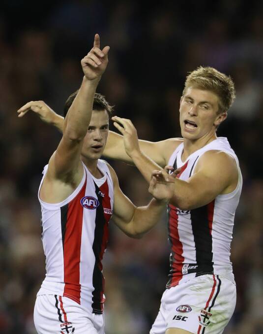 Sebastian Ross (right) celebrates a goal with Jack Sinclair during the round six clash against the Demons. Photo: Getty Images
