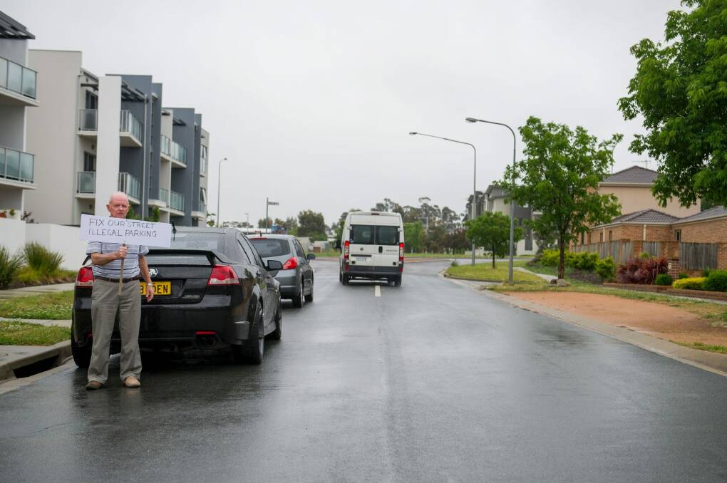 An example of how parked cars are forcing vehicles on to the wrong side of the street, potentially in the path of oncoming traffic exiting Flemington Road. Photo: Jay Cronan