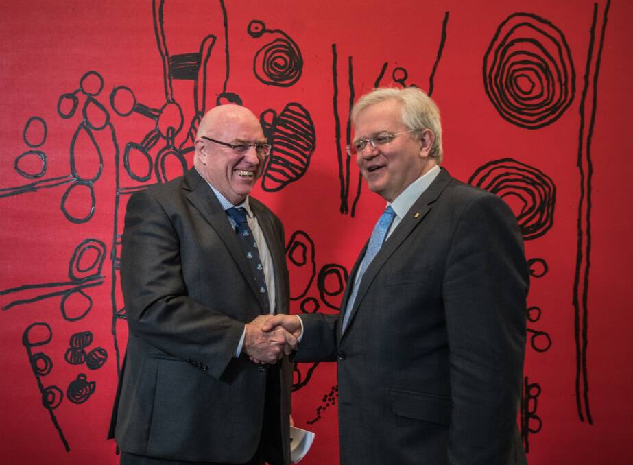 Canberra lawyer Craig Edwards with ANU vice-chancellor Brian Schmidt in front of one of the works Mr Edwards has just donated to the university.  Photo: Karleen Minney