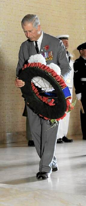 Charles, Prince of Wales lays a wreath on the tomb of the unknown Australian soldier at the Australian War Memorial. Photo: Graham Tidy