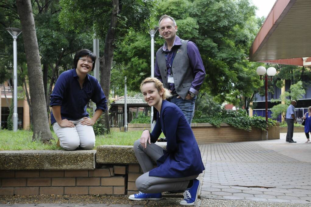 Charlene Liau, Natalia Weglarz and Hamish Sinclair said simple acts like filling cracked concrete with Lego could help revitalise the Tuggeranong town centre. Photo: Kimberley Granger