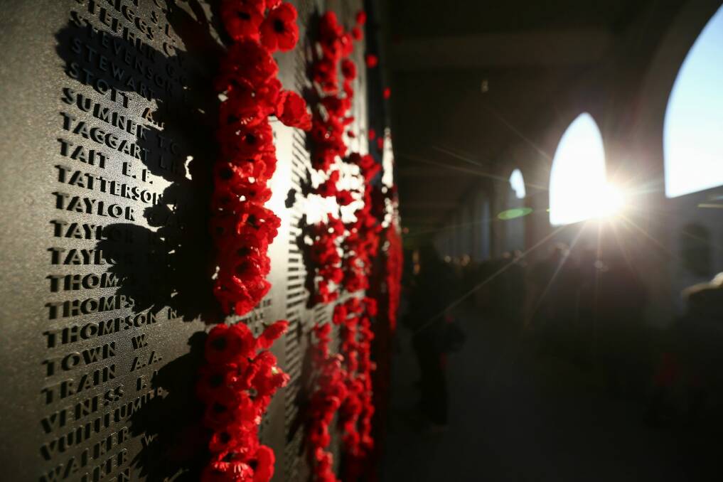 Poppies placed on the Roll of Honour, after  the Anzac Day Dawn Service at the Australian War Memorial. Photo: Alex Ellinghausen