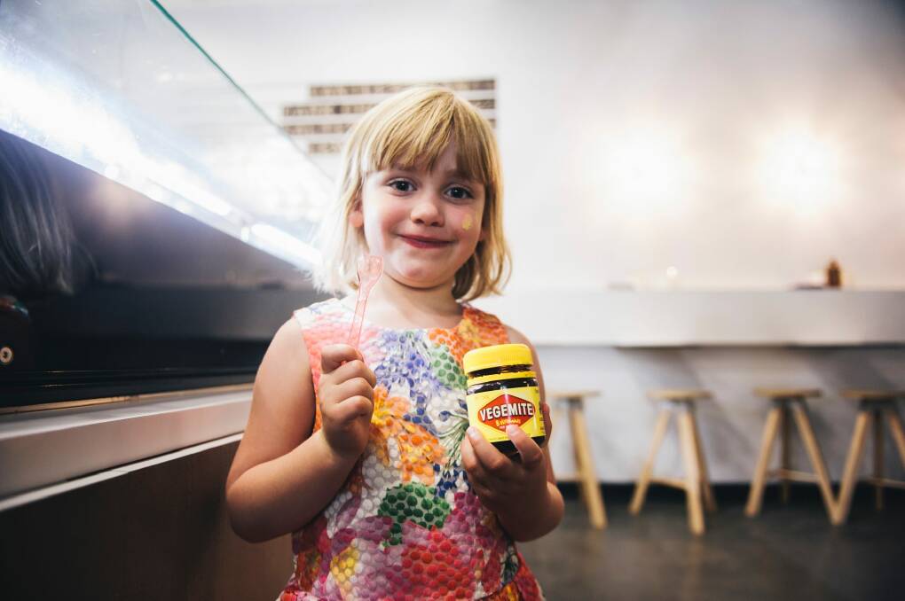 Zoe Doerr, of Watson, loved the Vegemite ice cream but her mum US-born Veronica, who earlier in the day became an Australian citizen, was not so sure. Photo: Rohan Thomson