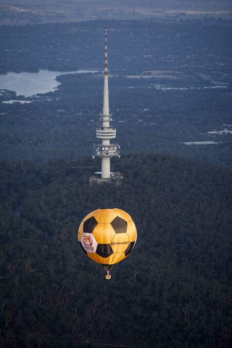The Asian Cup hot air balloon flying over Canberra on Thursday morning Photo: Jay Cronan