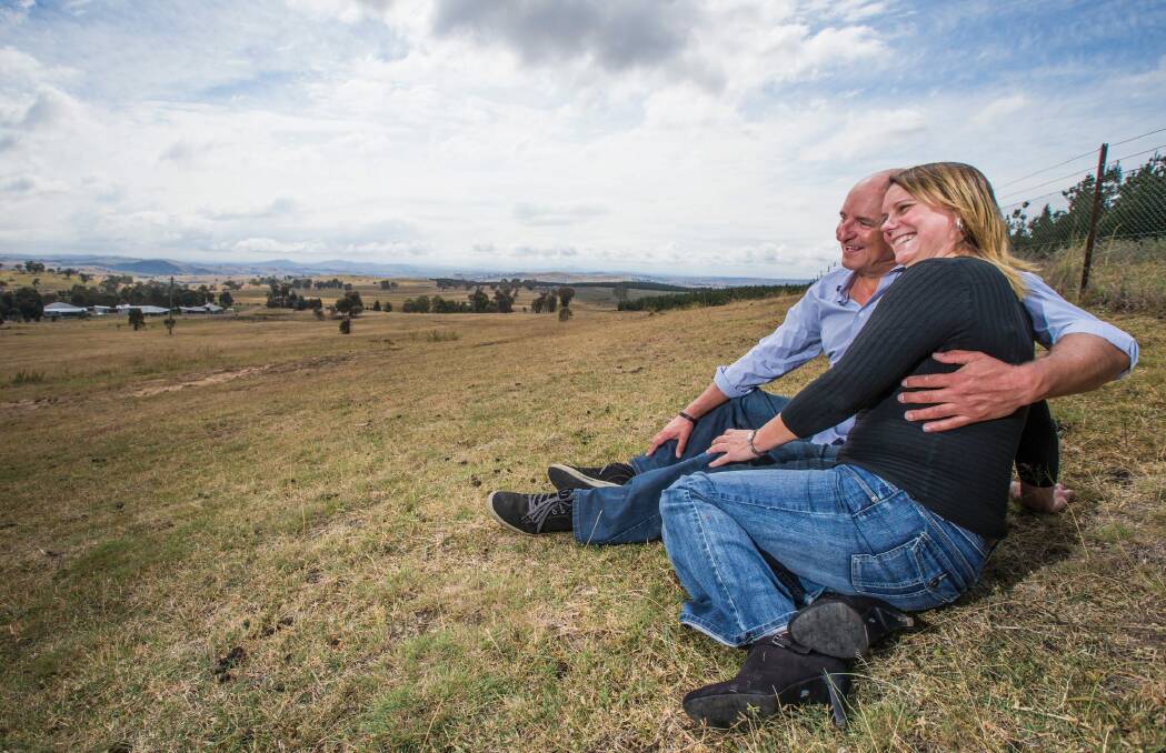 Leigh Allison and Michael Friedrich look over the Uriarra and the land that was to become a solar farm. Photo: Matt Bedford