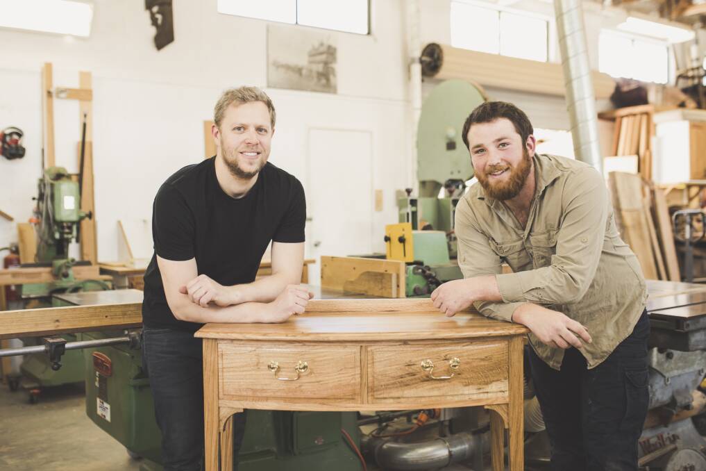 Canberra furniture makers, Rolf Barfoed and Douglas Keith, have designed and built three tables from the wood of the Eleanor Roosevelt tree for the American Embassy. Photo: Jamila Toderas
