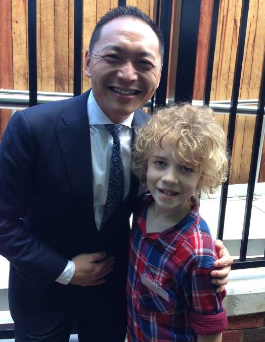 Max Harpham, 10, with Dr Phillip Chang who performed the surgery for his cochlear implant. Photo: Supplied