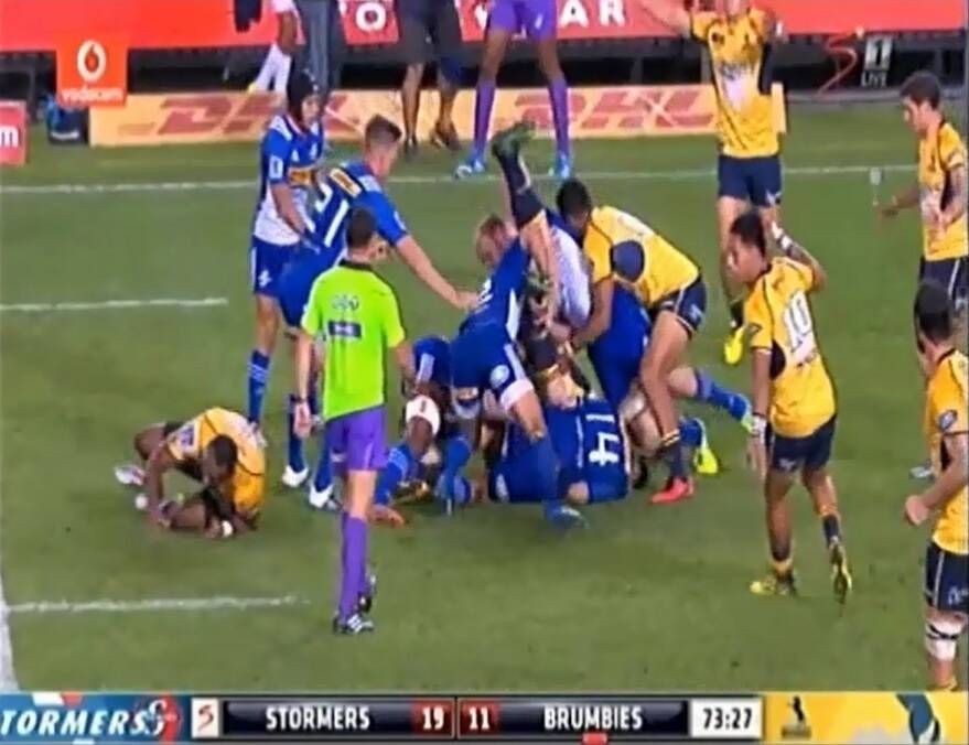 Brumbies player David Pocock is tipped on to his head by Stormers players Schalk Burger and Juan de Jongh in a Super Rugby match Photo: Supplied