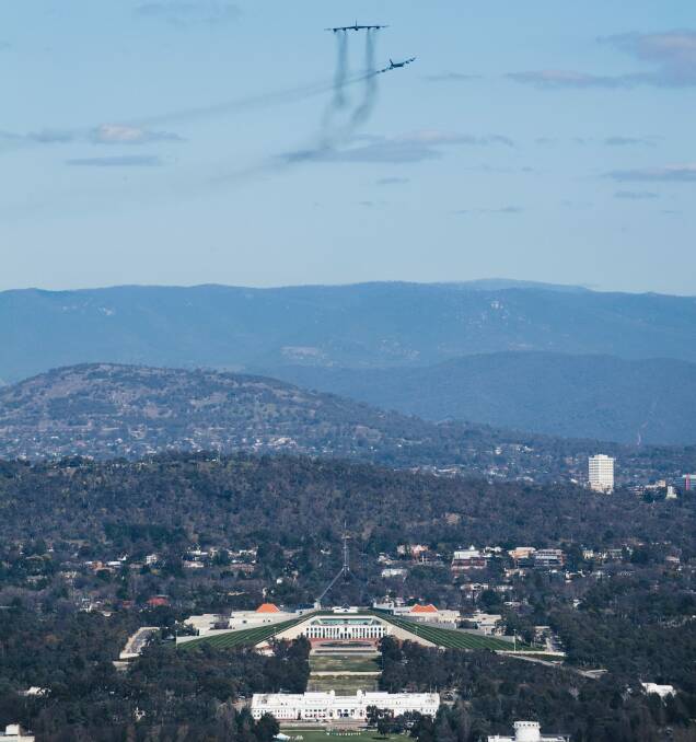 A view over Canberra as the Vietnam era USAF B-52 Bombers fly over. Photo: Rohan Thomson