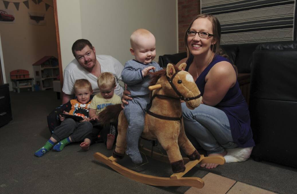 Sean and Eerika Donovan at their Gordon home, with their three boys, Riley, 3, Caden, 2, and nine-month-old Asher. Photo: Graham Tidy