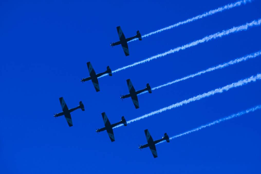 The RAAF Roulettes perform in formation over Canberra as part of ADFA's open day. Photo: Rohan Thomson
