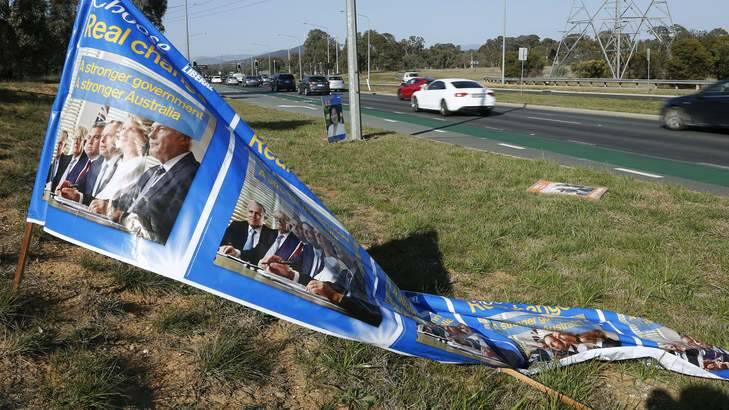 A Liberal Party election banner that had fallen over along Gungahlin Drive in Mitchell. Photo: Jeffrey Chan