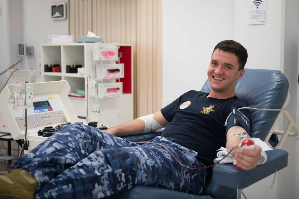 The Royal Australian Air Force's Mathew Hearn helps to save lives by donating plasma at the Red Cross Blood Donation Centre in Garran.