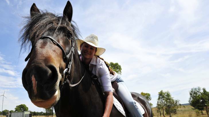 Owner of a stud horse farm near Bungendore, Lisa Wilson and her rare Shire Horse, Jock. Photo: Jay Cronan