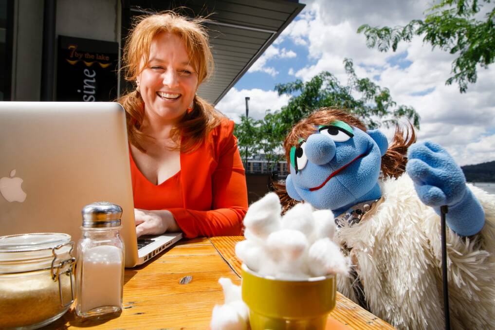 Caroline Simmone O'Brien enjoys some cafe time with Lady Puppet.  Photo: Sitthixay Ditthavong