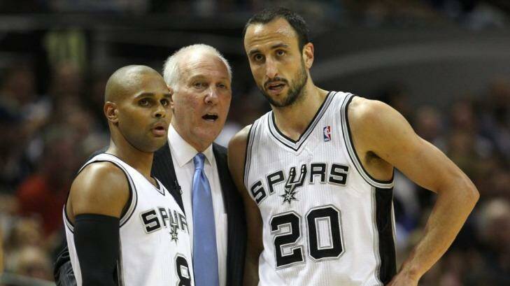 Patty Mills, left, with Spurs coach Gregg Popovich and Manu Ginobili. Photo: Getty Images