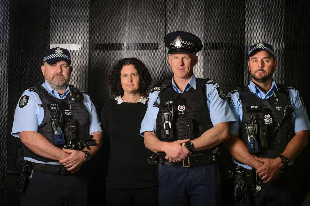 Members of the ACT Policing family violence unit: Detective leading senior constable Troy Gordon, Myfanwy Manning, detective station sergeant Matt Craft, and detective sergeant Dave Crowe.  Photo: Sitthixay Ditthavong