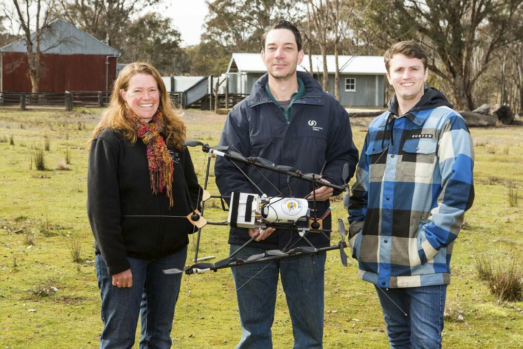 ANU researcher Dr Debra Saunders, with Jeremy Randle and Oliver Cliff of the University of Sydney, with their tracking drone.

 Photo: john.thistleton@canberratimes.co