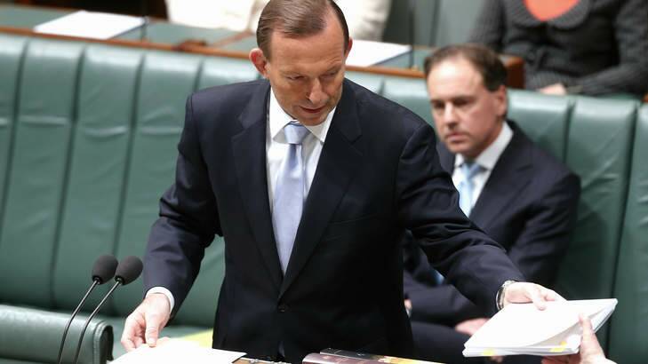 Prime Minister Tony Abbott re-introduces the Carbon Tax repeal bills in the House of Representatives. Photo: Alex Ellinghausen