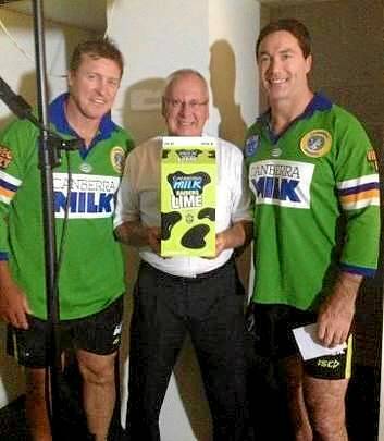 Raiders coach David Furner (left) with club legend Bradley Clyde (right) wearing old Canberra jerseys to help launch Raiders Lime Milk.