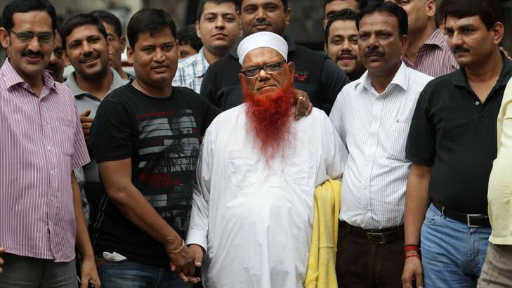 Indian policemen in plain clothes surround Abdul Karim alias Tunda, centre in white cap. Photo: AP