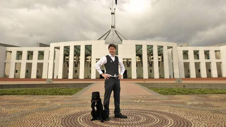Steven Bailey and his dog Bruce at Parliament House. Photo: Jay Cronan