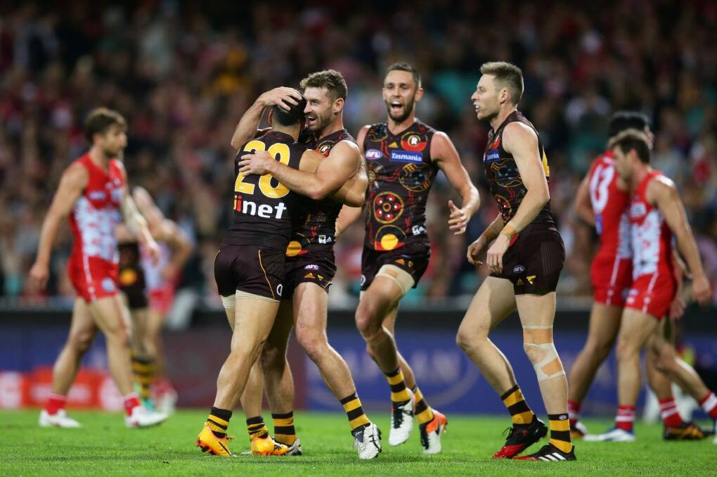 Knockout blow: Hawthorn snatched a last minute victory to stem a Sydney Swans comeback at the SCG. Photo: Matt King