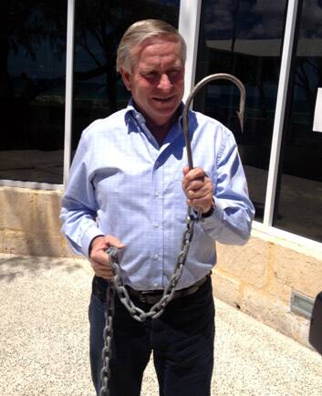 Premier Colin Barnett with one of the hooks used to catch sharks. Photo: Aleisha Orr