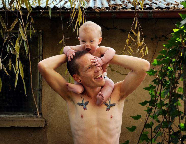 Walker Chris Erikson with his 9month old son Oliver, Chris was chosen in the Olympic squad. Photo: Colleen Petch
