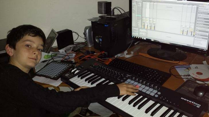 Canberra boy Rhys Toms producing music in his "studio", aka his dad's home office. Photo: Supplied