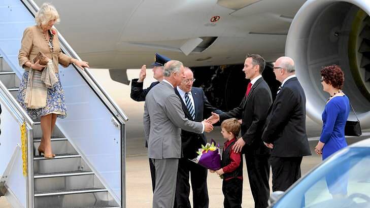 Prince Charles meets Andrew Leigh MP, representing the Government, with his 5-year-old son, Sebastian. Photo: Graham Tidy