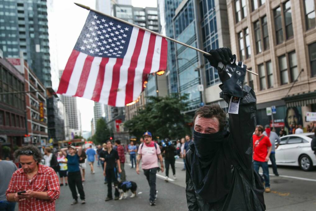 An anti-Trump protester in Seattle in August. Photo: Grant Hindsley