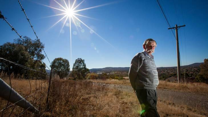 Bill Mayne, a retired RAAF group captain, was a junior bomb disposal officer in 1973 and worked to clear a practice range where Tuggeranong and Bonython now stand. Photo: Katherine Griffiths