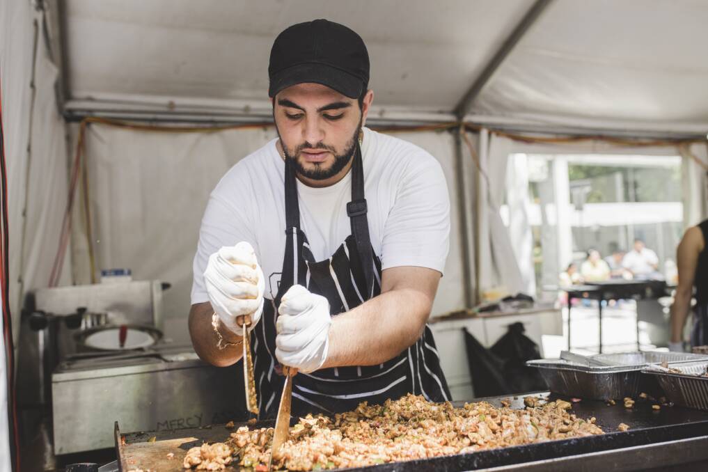Sorial Ibraheil of the mercy association making chicken shawarma at the National Multicultural Festival last year. Photo: Jamila Toderas