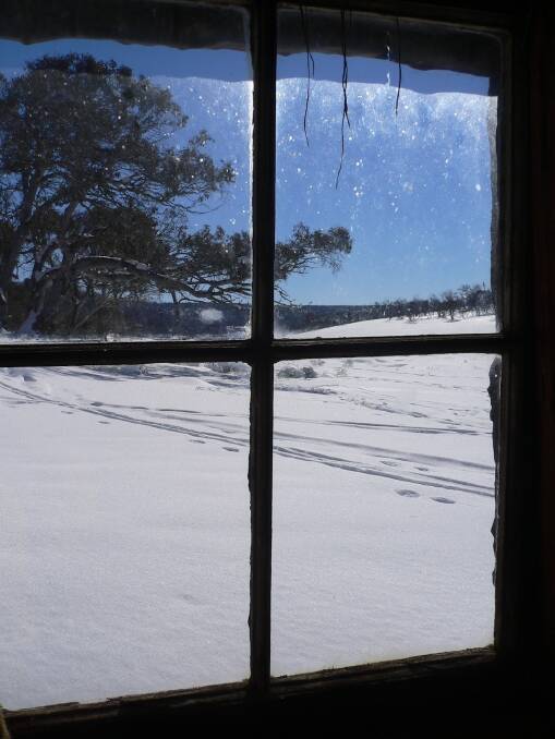 Winter Wonderland: Looking out from inside the welcome shelter of Four Mile Hut. Photo: Matthew Higgins