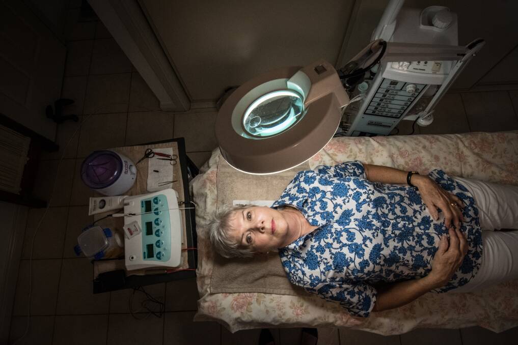 Beauty therapist Narelle Blinman has had to keep working at the age of 75 because of the changes to the ACT's taxi plate licensing system. Photo: Karleen Minney