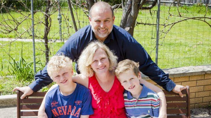Canberra Mother of two Megan James, centre, has been twice diagnosed with breast cancer. She  pictured with sons Griffin 10, left, and Dylan 8, right, and David Hutchins, rear. Photo: Jamila Toderas