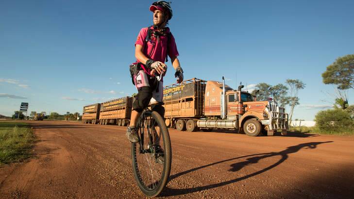 Actor come Transcontinental Unicyclist Samuel Johnson at Daly Waters, 600 km south of Darwin on his round Australia Unicycle Ride inspired by his sisters battle with breast cancer. Photo: Glenn Campbell