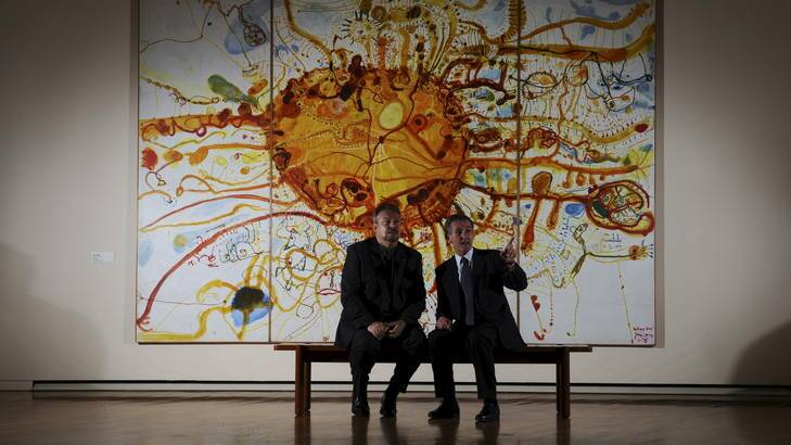 Director of The British Museum, Neil MacGregor, right, is in Canberra to deliver the Robert Hughes Lecture. National Gallery Director, Rod Radford, speaks with Mr MacGregor in front of the John Olsen work, <i>SydneySun</i>. Photo: Graham Tidy