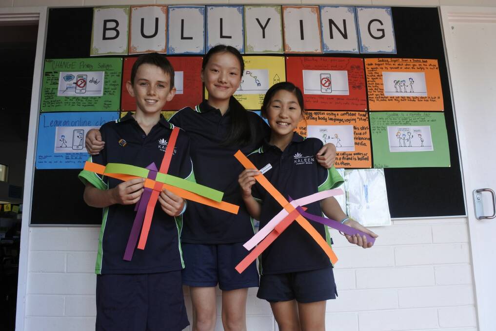 Kaleen Primary School Year 6 students Matt Beard-Browning, Amy Zheng and Taylor Wong have taken a stand against bullying. Photo: Emily Baker