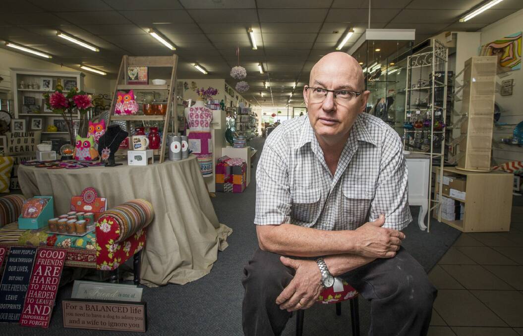 Barry Taylor, pictured in his Queanbeyan store Gifts and Gadgets, is now working six and sometimes seven days a week to save staffing costs.
 Photo: Photo by Matt Bedford