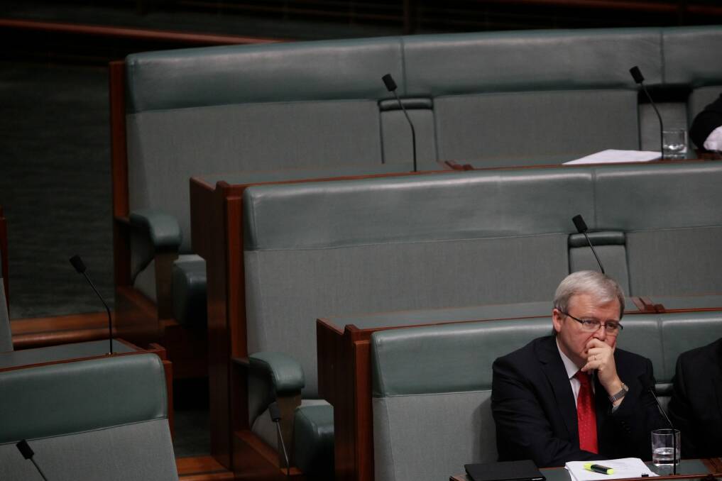 Labor MP Kevin Rudd sits on the backbench during Question Time at Parliament House after his demotion. Photo: Alex Ellinghausen